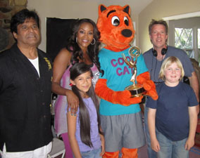 Cool Cat holding an EMMY Award